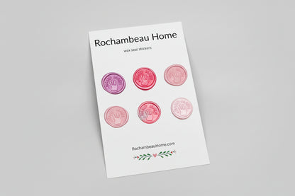 “Hand Made” wax seal stickers created by Rochambeau Home with 3D embossed handprint in a pink theme
