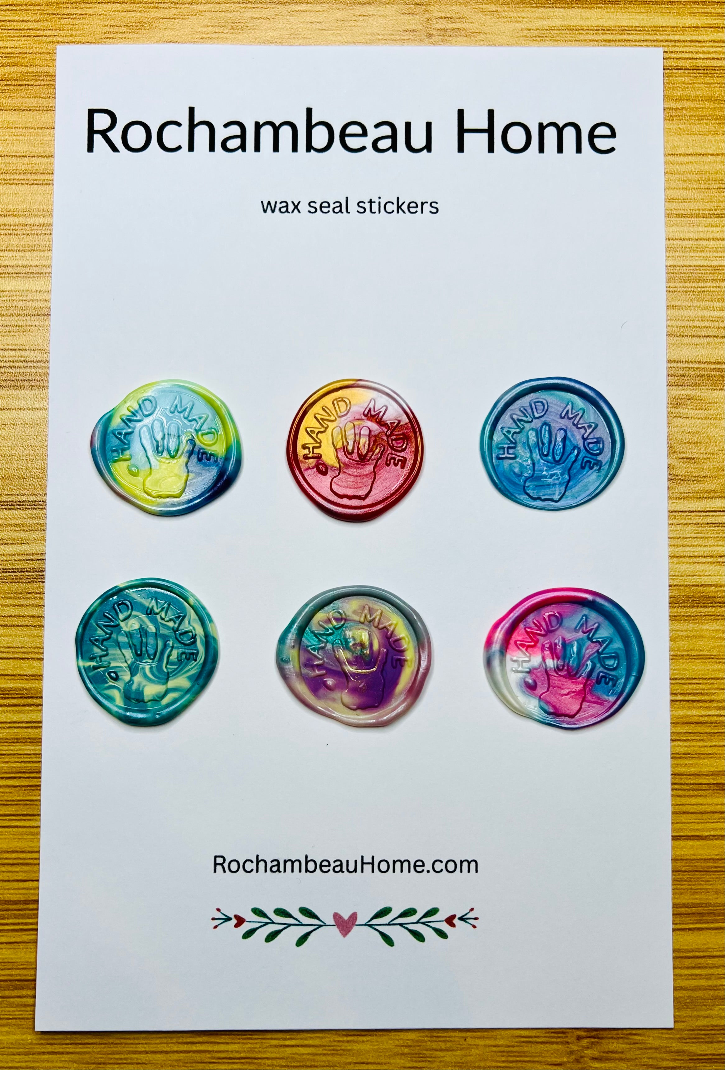 “Hand Made” wax seals with 3D embossed handprint in a rainbow multicolor theme