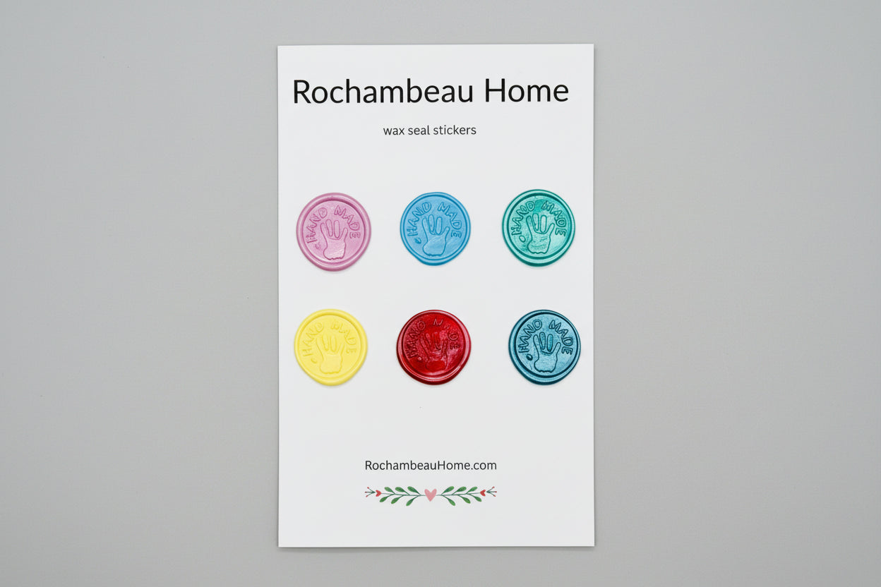 “Hand Made” wax seal stickers created by Rochambeau Home with 3D embossed handprint in a solid multicolor theme