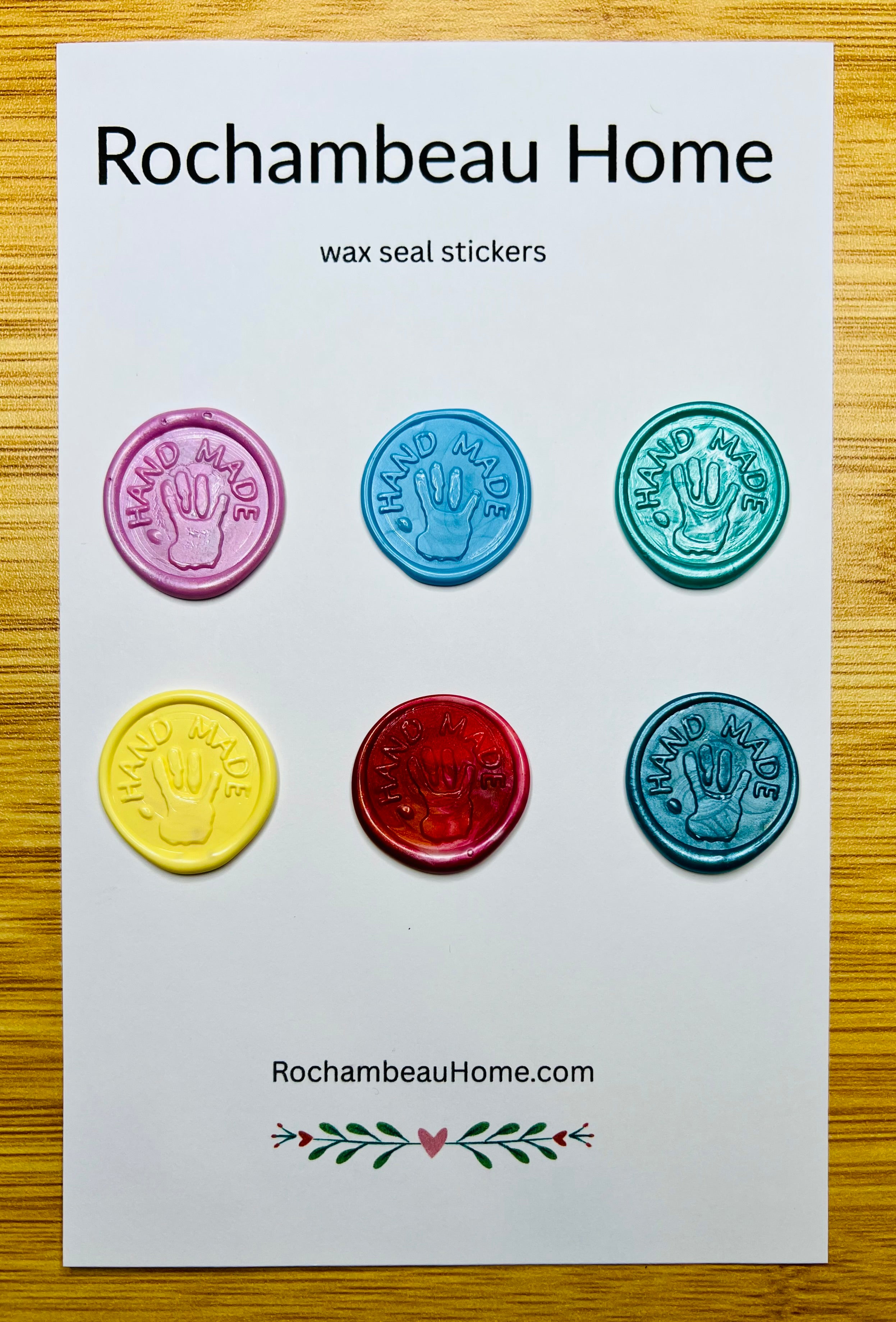 “Hand Made” wax seals with 3D embossed handprint in a solid multicolor theme