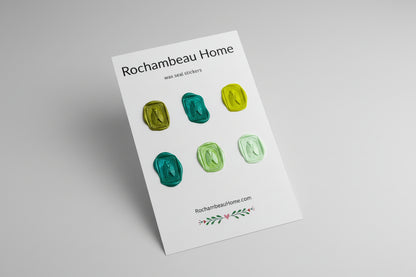 Intricate cicada wax seal stickers created by Rochambeau Home in a green theme