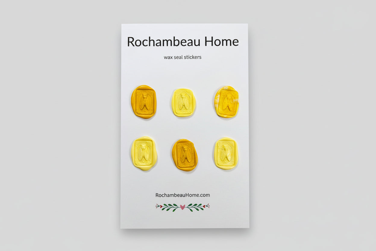 Intricate cicada wax seal stickers created by Rochambeau Home in a yellow theme
