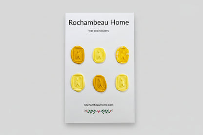 Intricate cicada wax seal stickers created by Rochambeau Home in a yellow theme