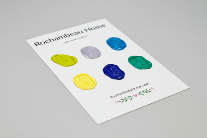 Intricate cicada wax seal stickers created by Rochambeau Home in a solid multicolor theme
