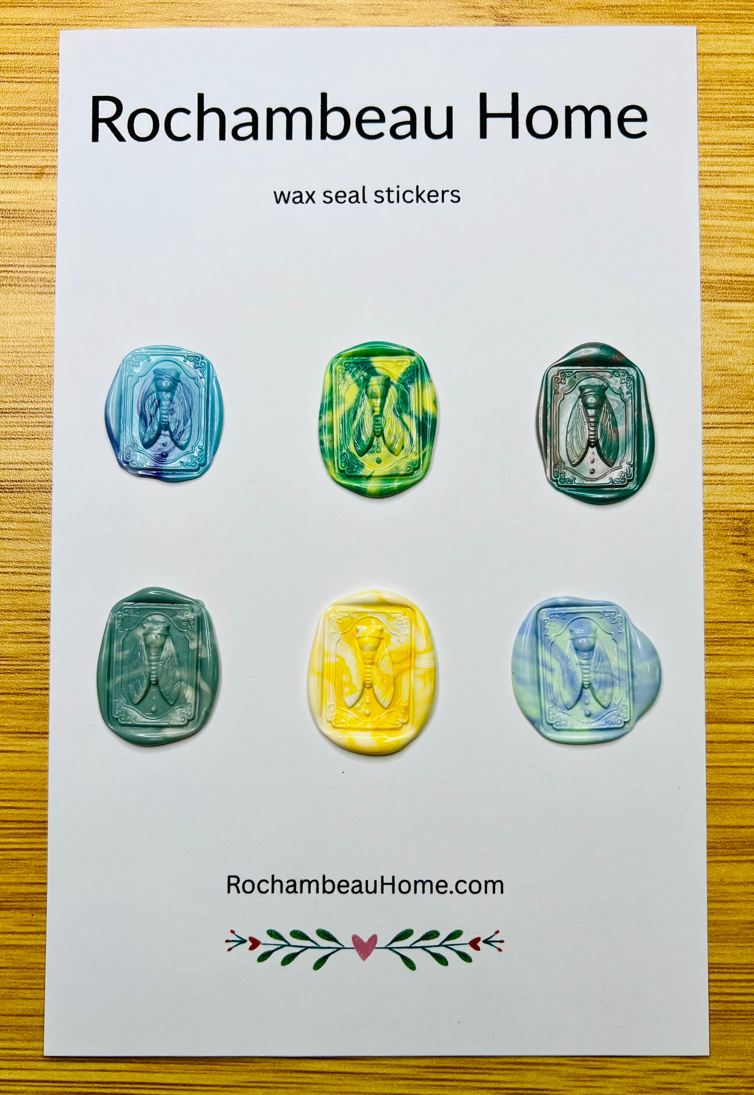 Intricate cicada wax seal stickers in a rainbow multicolor theme
