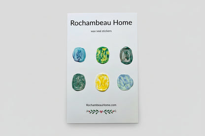 Intricate cicada wax seal stickers created by Rochambeau Home in a rainbow multicolor theme