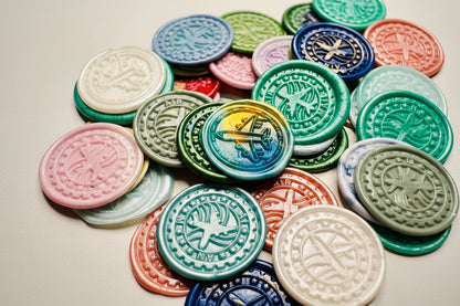 Close up view of the Vintage-Inspired Airplane wax seal sticker in a multicolor theme
