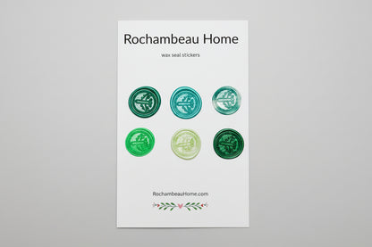 Set of green wax seal stickers on a white card with 'Rochambeau Home' branding card.
