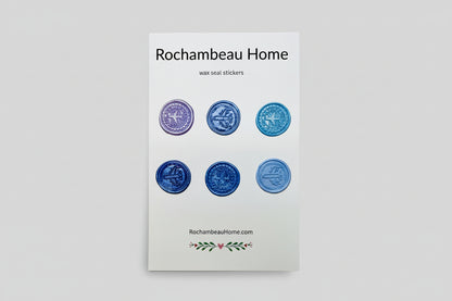 Mix of airplane embossed wax seal stickers created by Rochambeau Home in a purple theme.