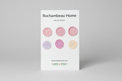 Mix of airplane embossed wax seal stickers created by Rochambeau Home in a pink theme.