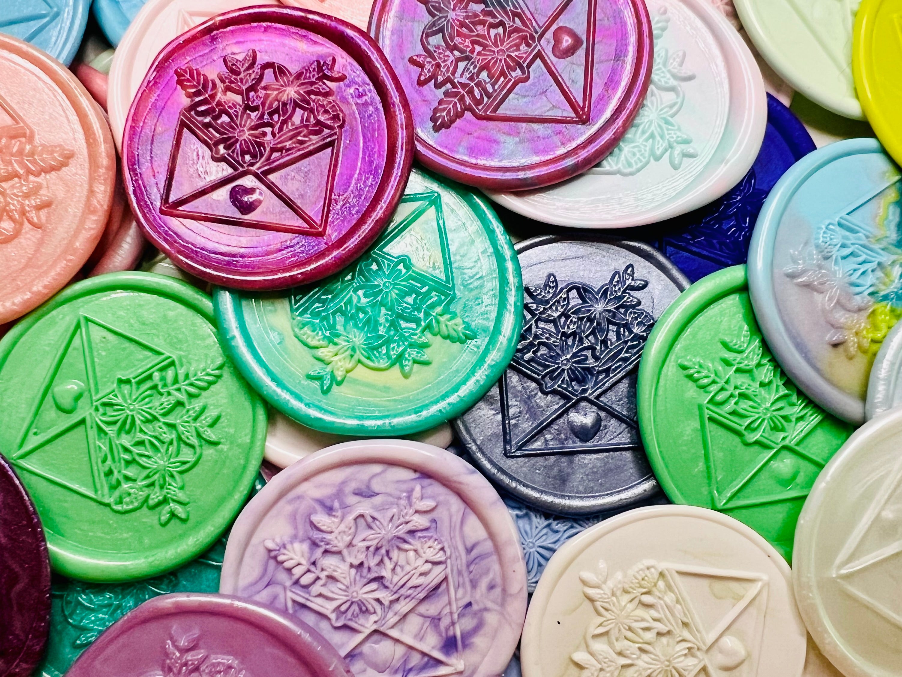 Close up view of the Cottagecore Floral Envelope wax seal stickers in various colors