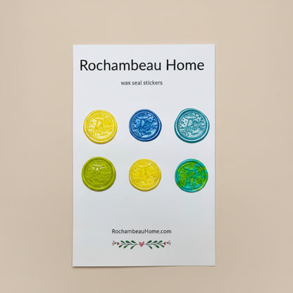 Set of wax seal stickers by Rochambeau Home on a white card with a wooden border.