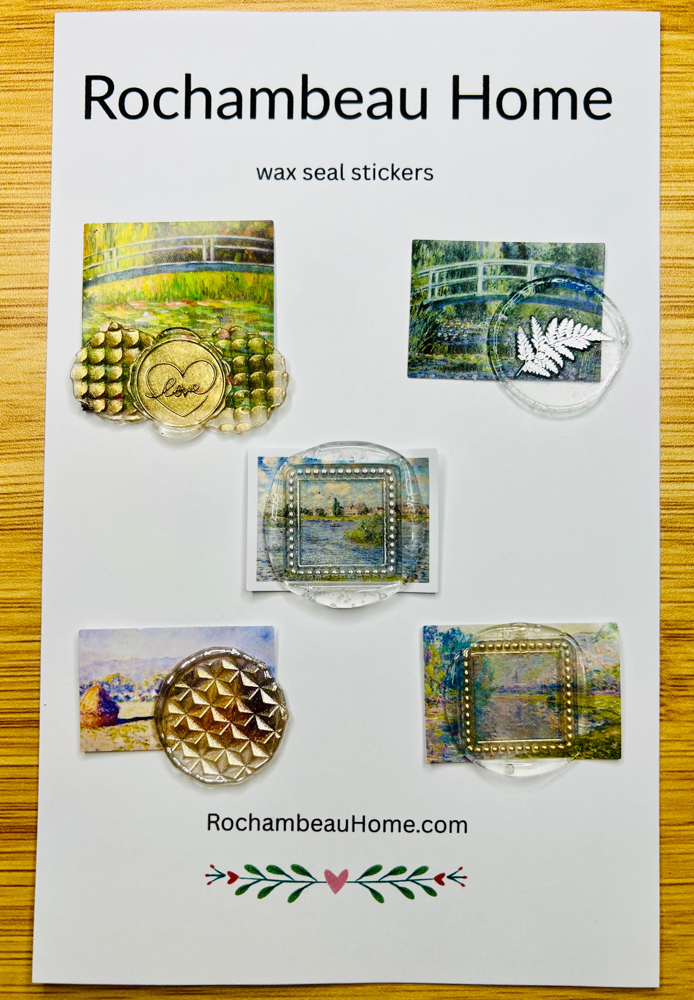 Close-up of a handcrafted wax seal sticker with gold accents over an impressionist landscape (Art Deco 002)