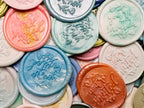 Close up view of the Handcrafted “You’re Invited” wax seal stickers in various colors