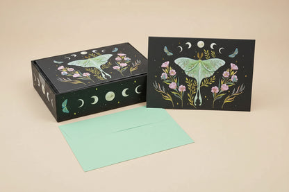 Greeting card with lunar moth design and matching box on a beige background