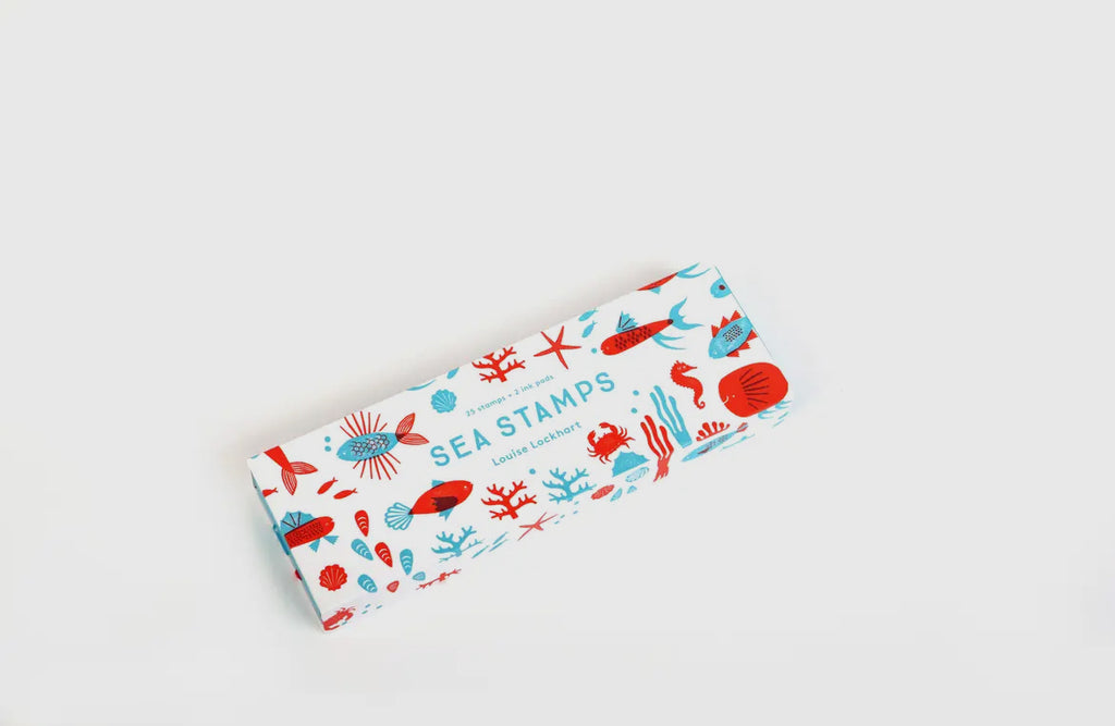 Colorful rubber stamp set featuring ocean-themed shapes like fins, shells, and tails