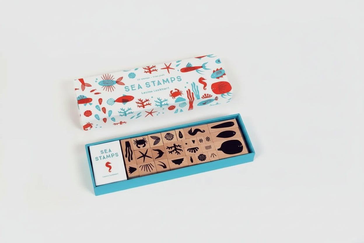Set of sea-themed rubber stamps in a box with a colorful label on a white background