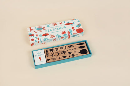 Set of sea-themed rubber stamps in a box with a colorful label on a white background