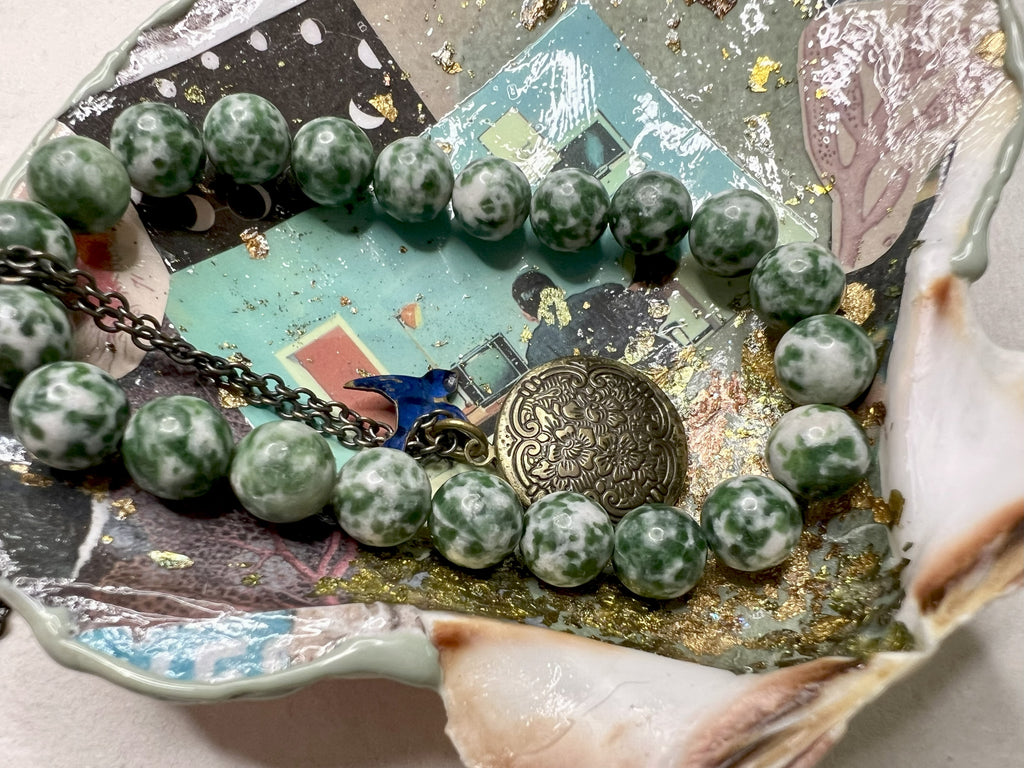 Mixed media shell tray with celestial and botanical imagery