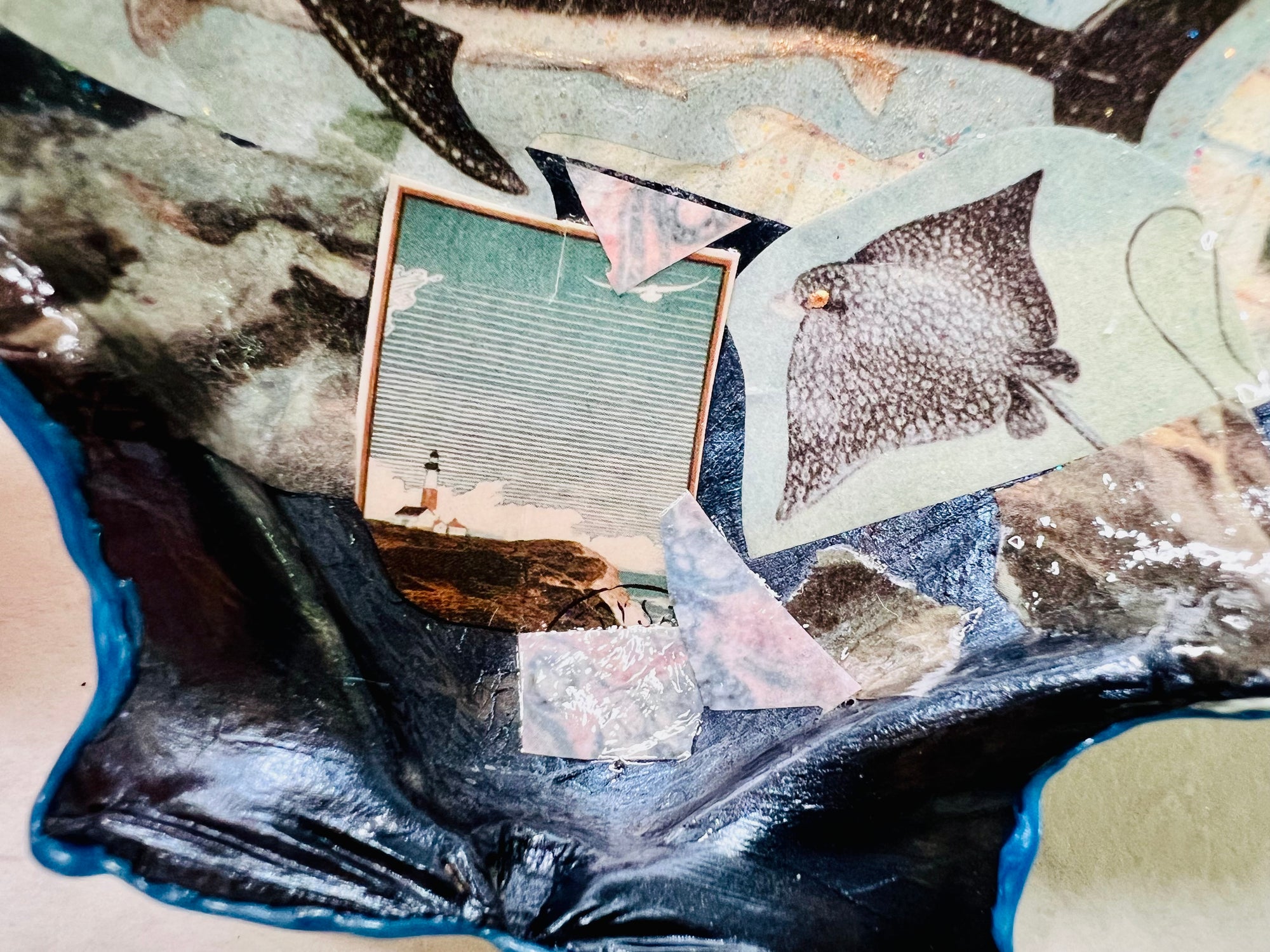Collaged seashell tray featuring marine animals and lighthouse print