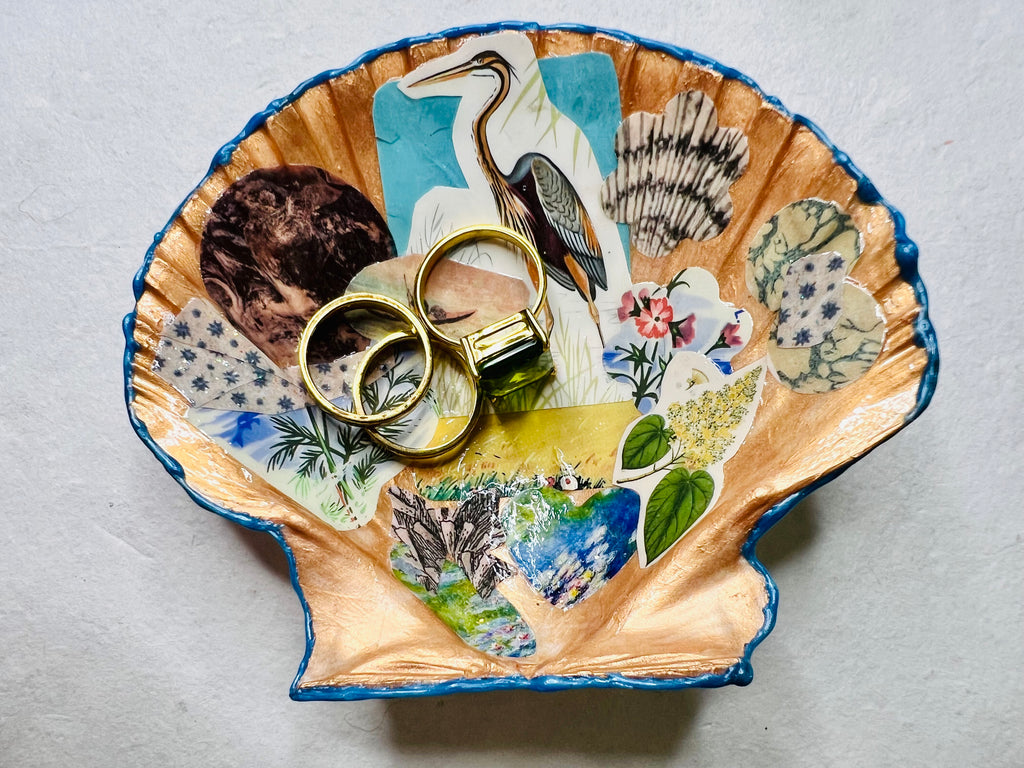 Collaged, vintage-style trinket shell featuring sea life, shells, moon phases, and a heron motif