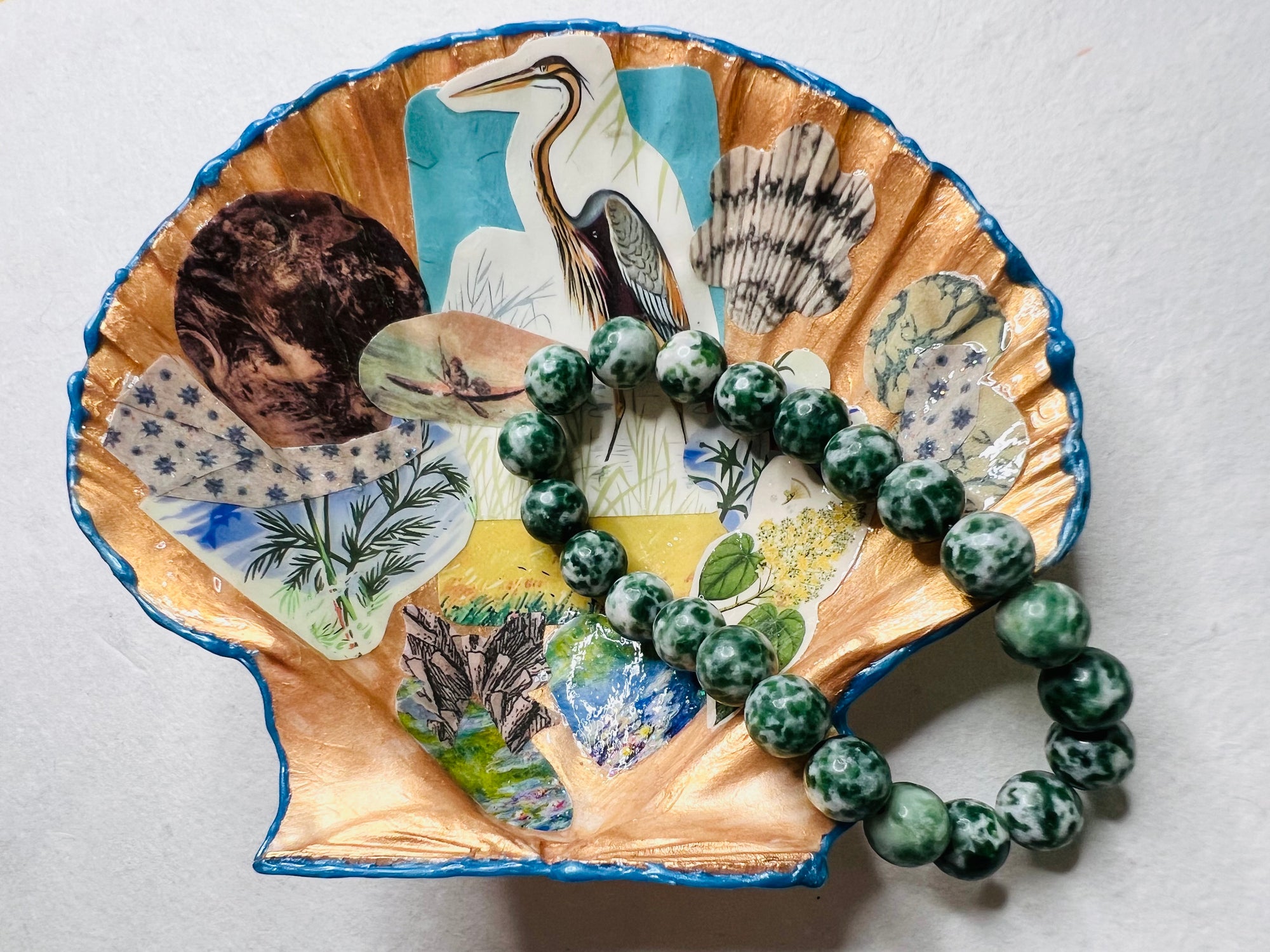 Handmade gold shell catch-all with bird-themed collage