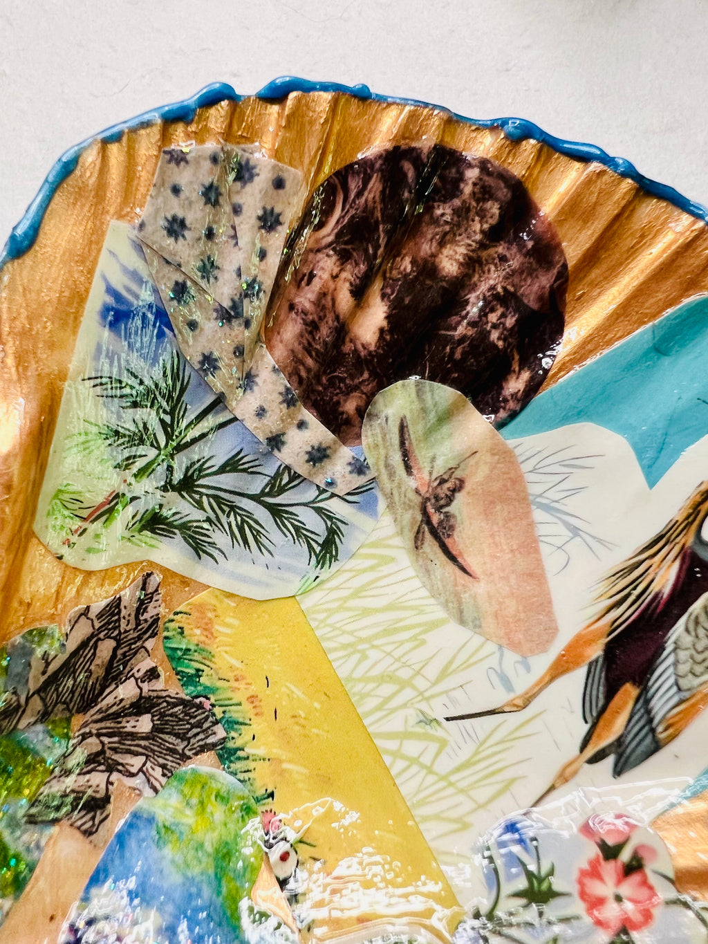 Handmade trinket shell with vintage collage art featuring sea life, shells, moon phases, and a heron illustration