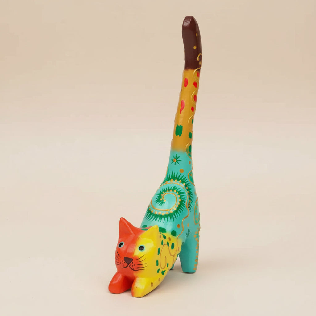 Colorful cat-shaped figurine ring holder with intricate patterns on a white background