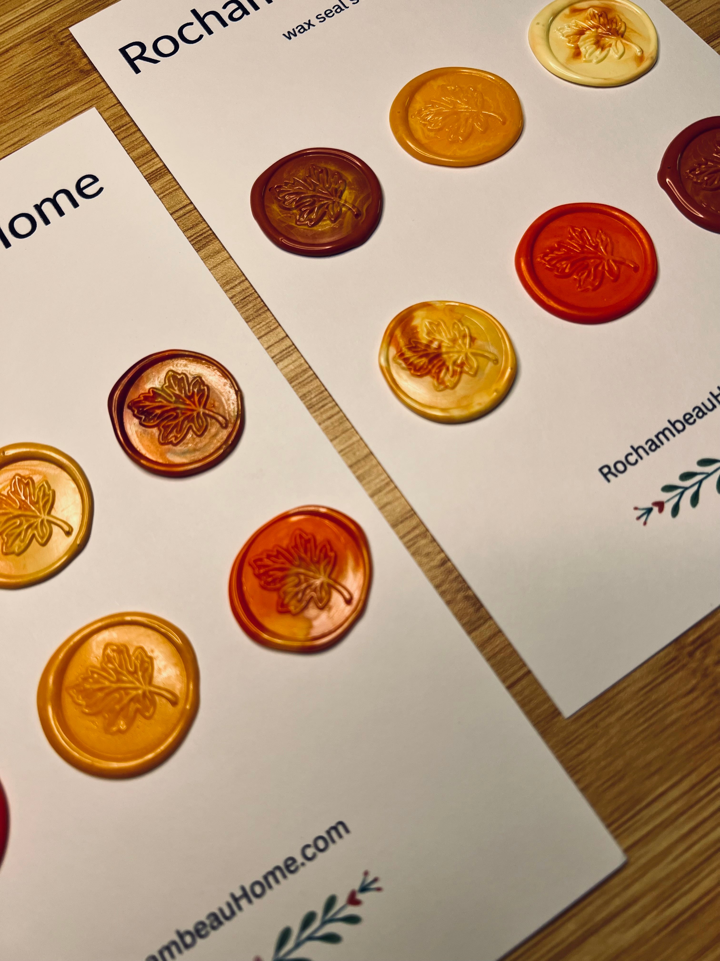 Falling for You Maple Leaf Wax Seal Stickers on cards with 'Rochambeau Home' branding on a wooden surface.