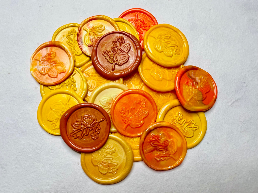 A lovely pile of the Golden Harvest Oak Leaf & Acorn Wax Seal Stickers showcasing beautiful fall colors