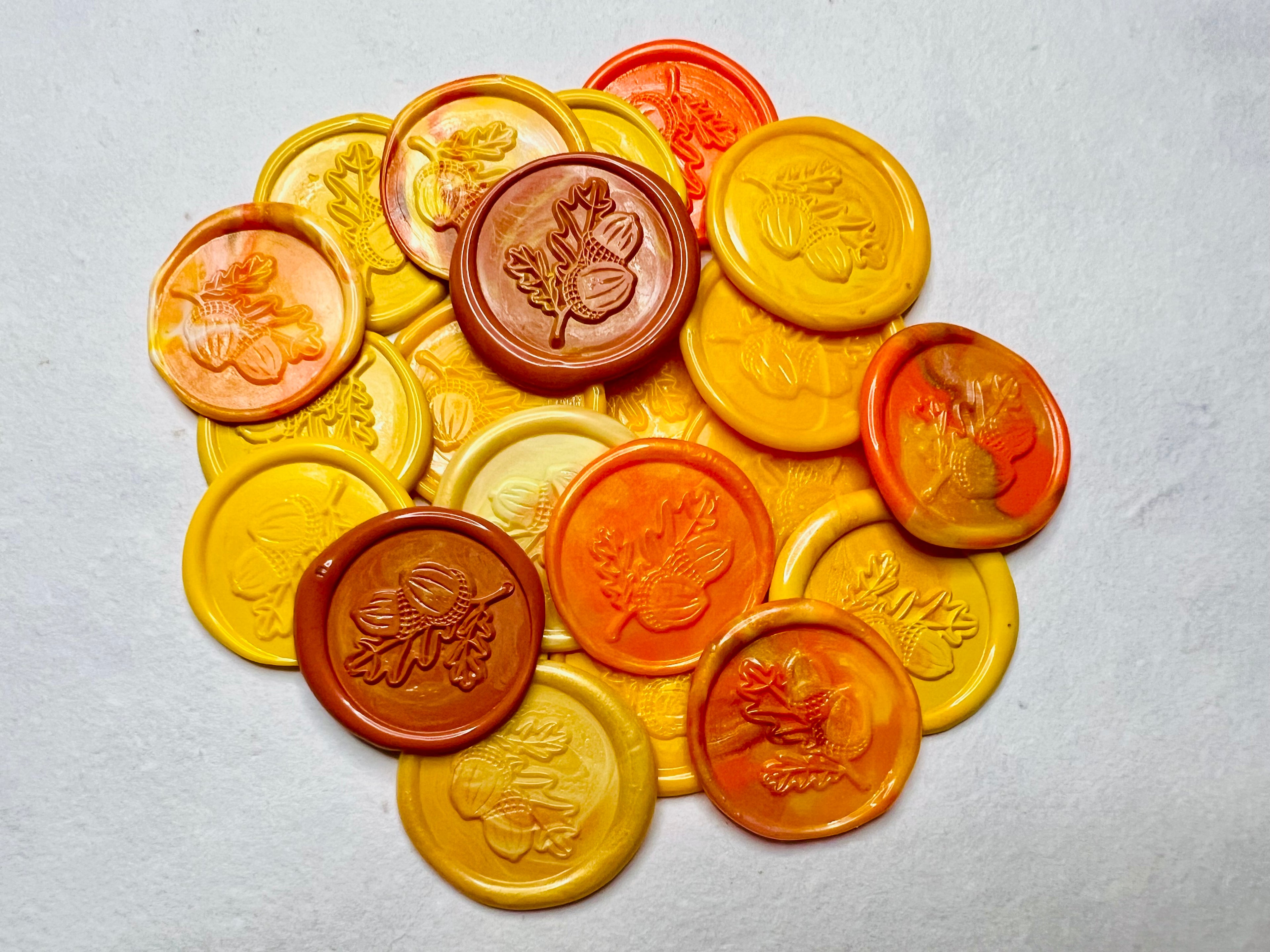 A lovely pile of the Golden Harvest Oak Leaf & Acorn Wax Seal Stickers showcasing beautiful fall colors