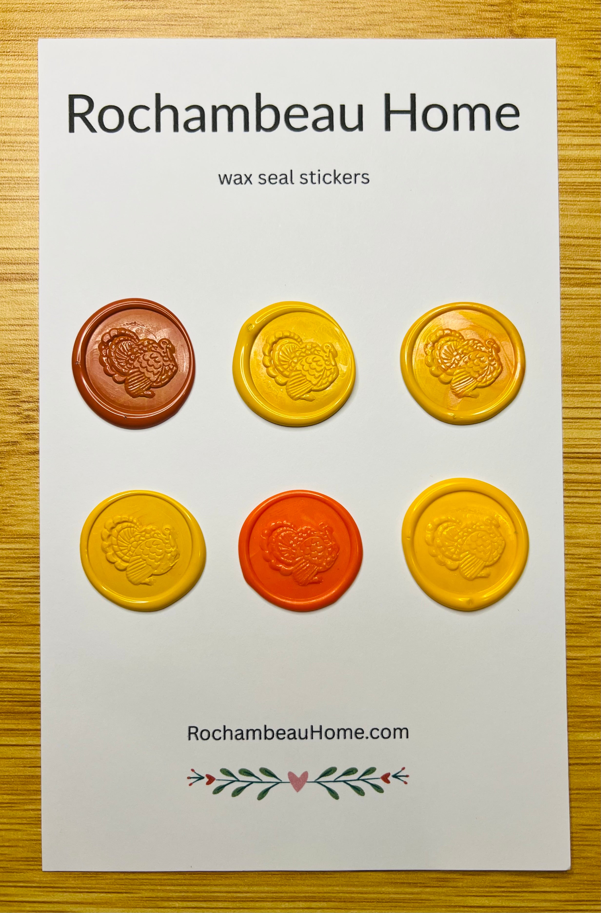 Packaging of Rochambeau Home Festive Turkey Wax Seal Stickers on a wooden surface