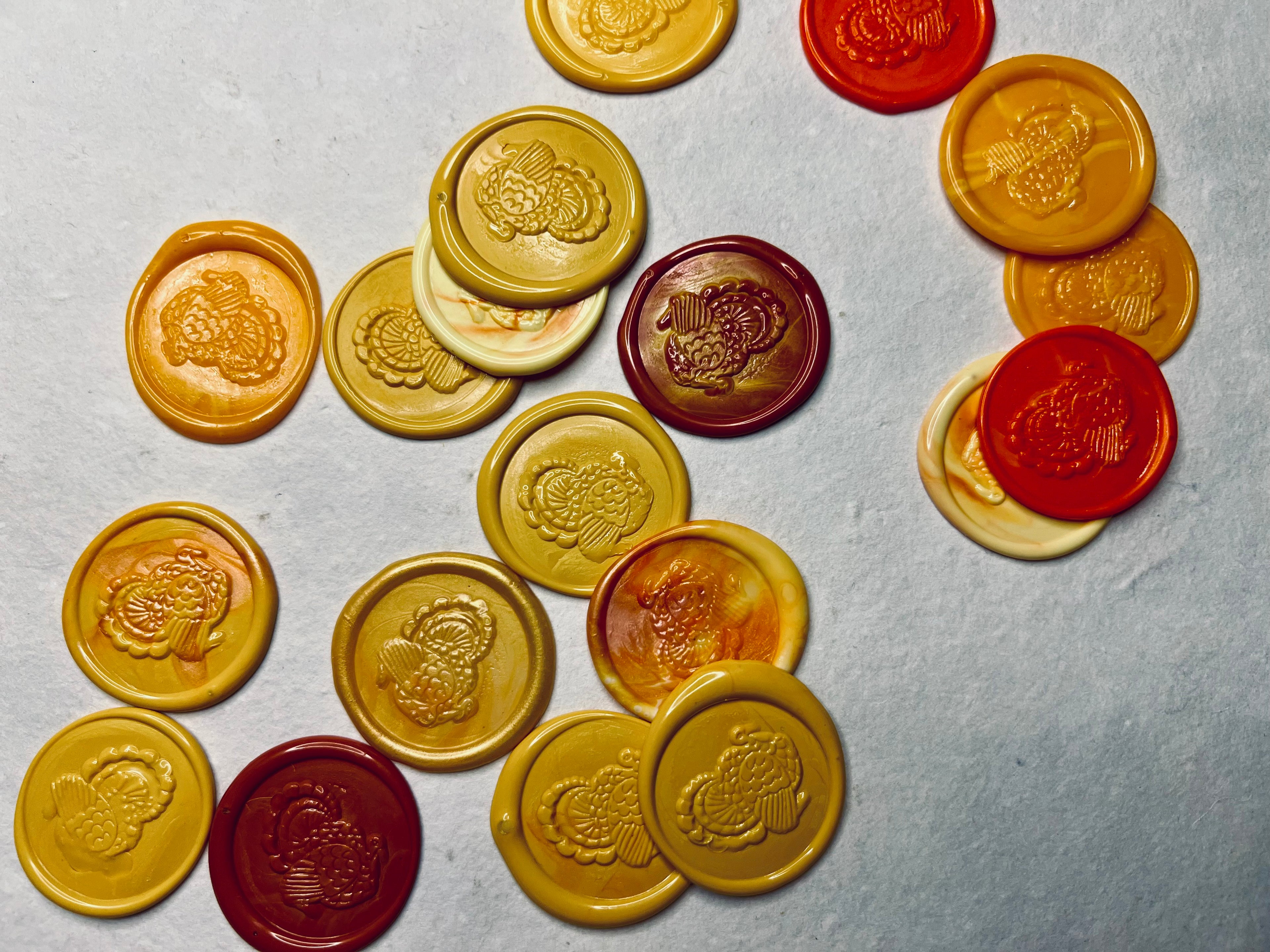 Festive Turkey Wax Seal Stickers in a pile on natural handmade paper