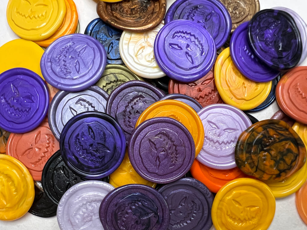 Assorted colorful Angry Pumpkin wax seal stickers with various designs on a white background