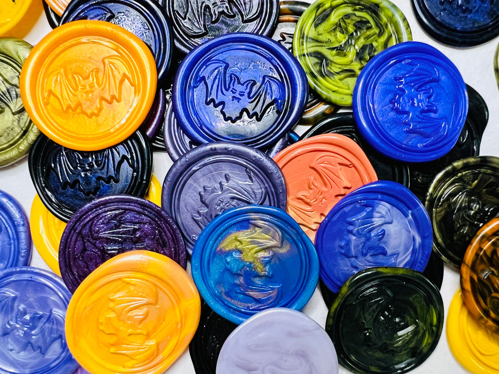 Close up view of the Spooky Bat Wax Seal Stickers in various colors