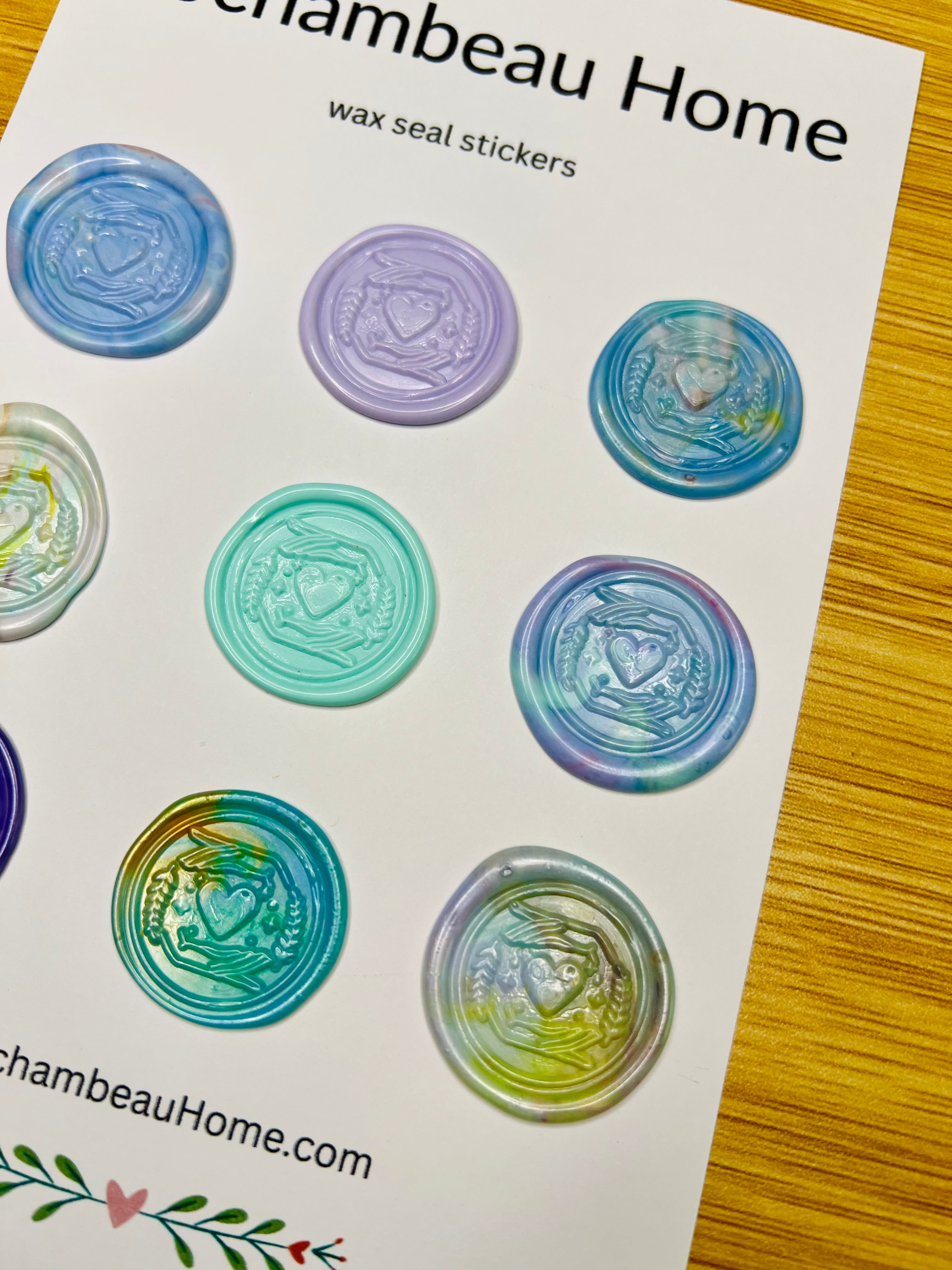 Side view of the Heart & Hand Wax Seal Stickers showing the detail of the embossed stamp