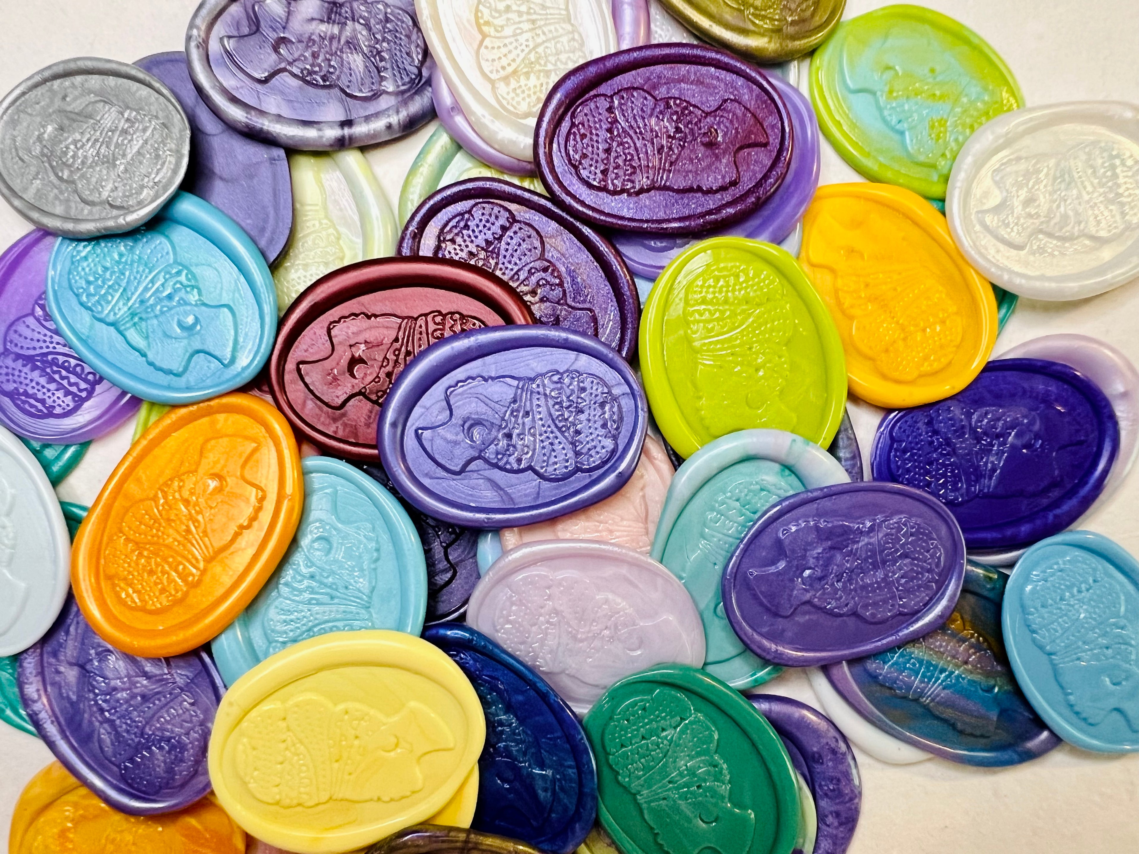 Close up view of the Heritage Headwrap Wax Seal Stickers in various vibrant colors