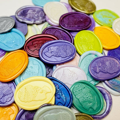 Close up view of the Heritage Headwrap Wax Seal Stickers in various vibrant colors