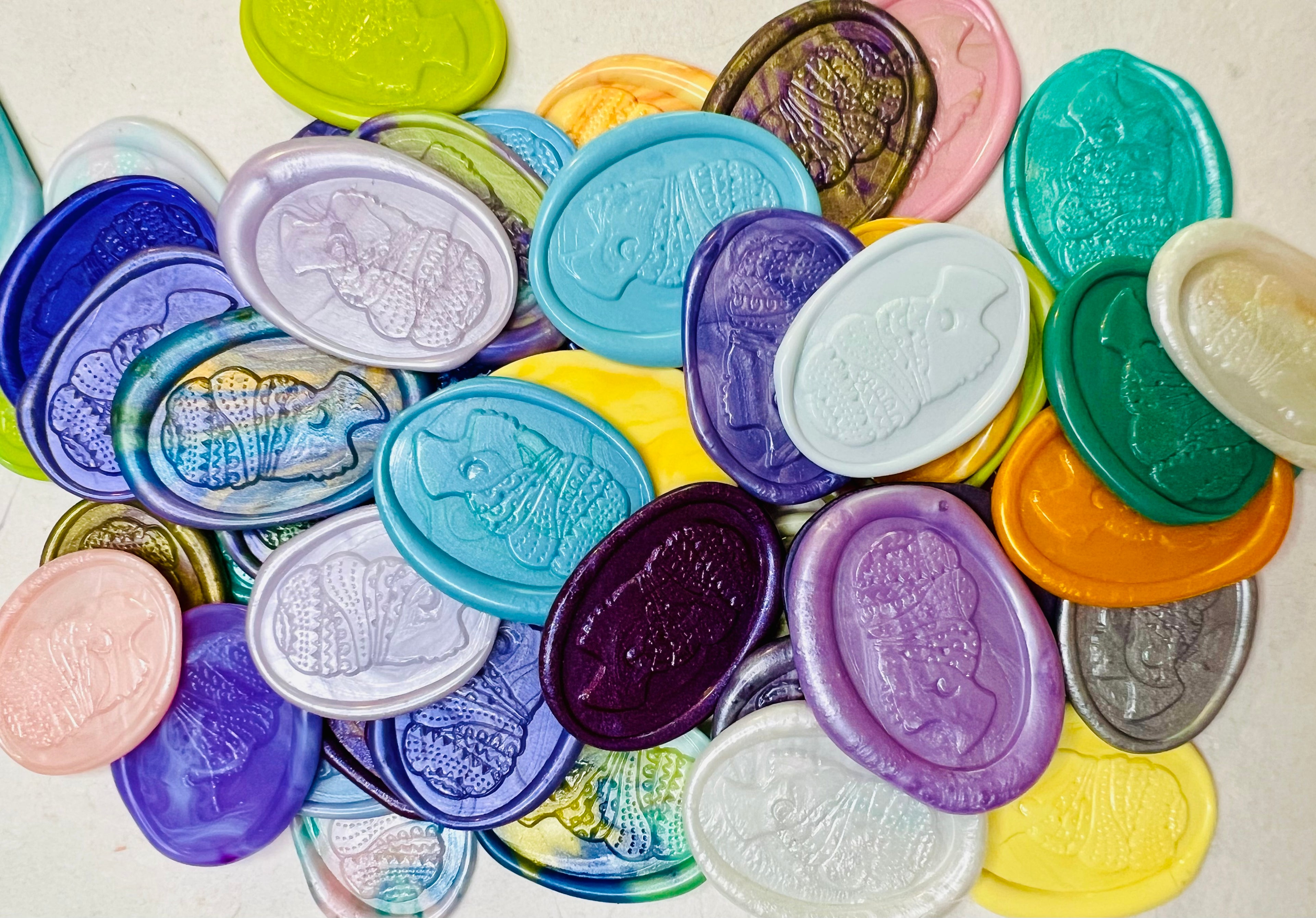 Assorted Heritage Headwrap Wax Seal Stickers piled up to show the ornate detail