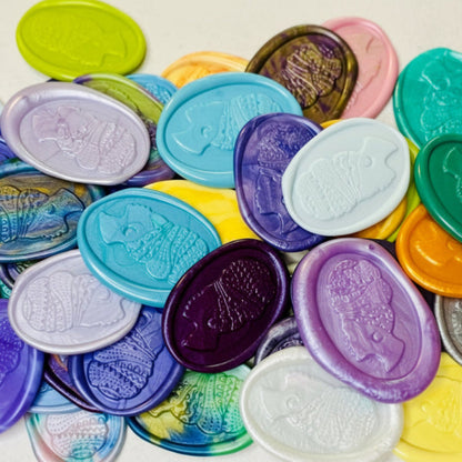 Assorted Heritage Headwrap Wax Seal Stickers piled up to show the ornate detail