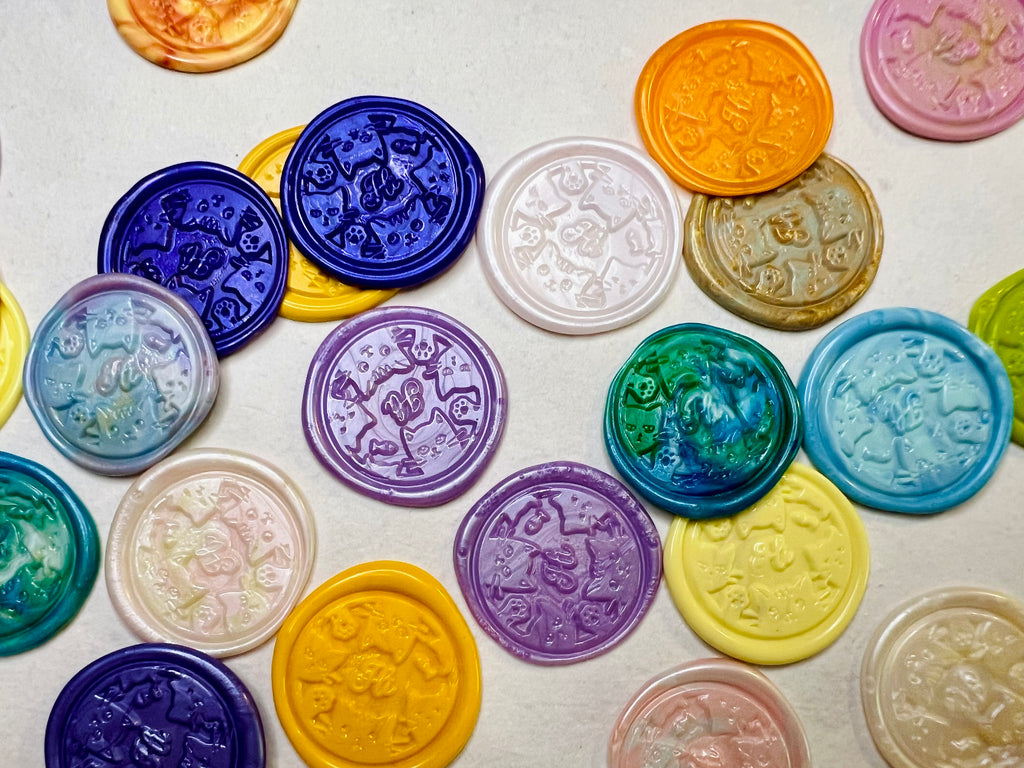 Colorful Hi Kitty Wax Seal Stickers shown on natural handmade paper