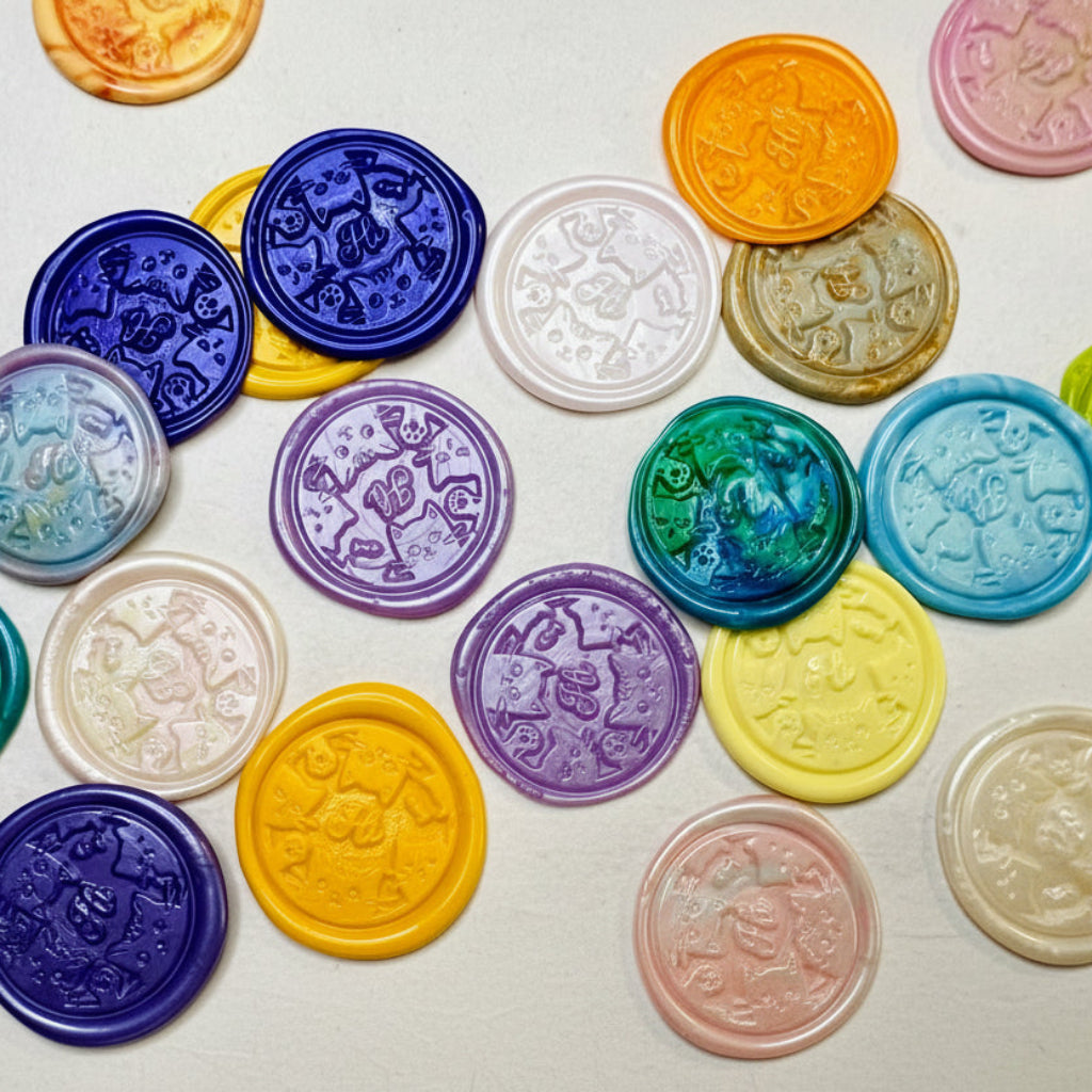 Colorful Hi Kitty Wax Seal Stickers shown on natural handmade paper