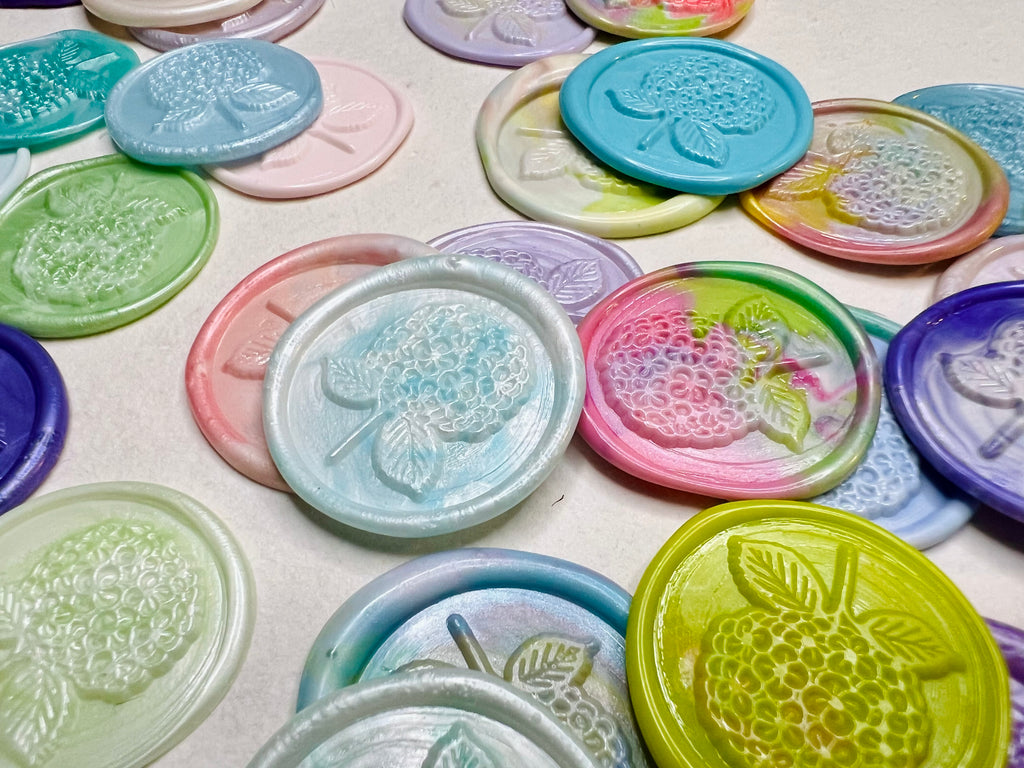 Hydrangea Bloom Wax Seal Stickers are embossed with a hydrangea bloom in various wax colors