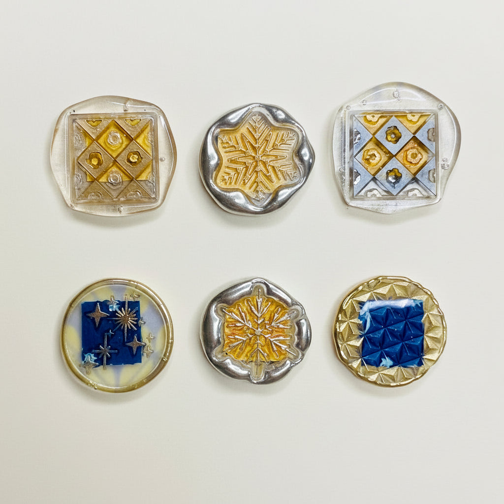 Decorative magnets with geometric patterns on a patterned background
