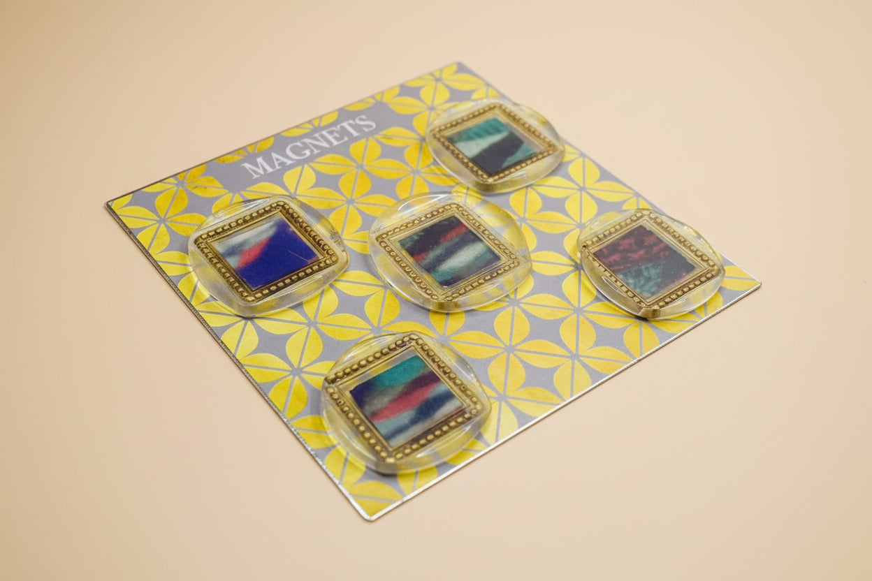 Set of five wax seal magnets with colorful and cozy stripes on a patterned card labeled 'Magnets'.
