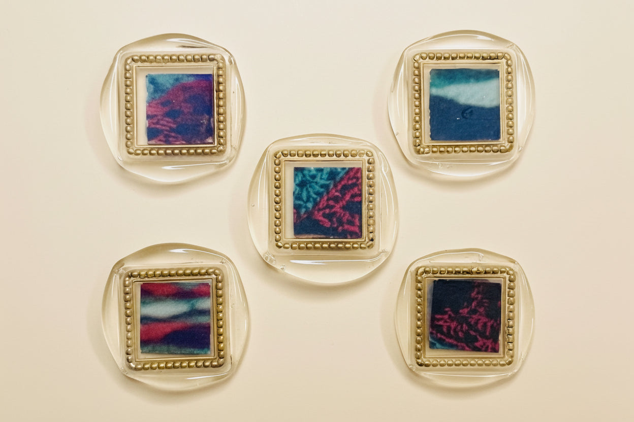 Five wax seal magnets with Deep Gold gilding wax details created by Rochambeau Home.