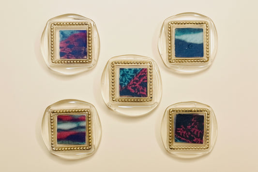 Five wax seal magnets with Deep Gold gilding wax details created by Rochambeau Home.