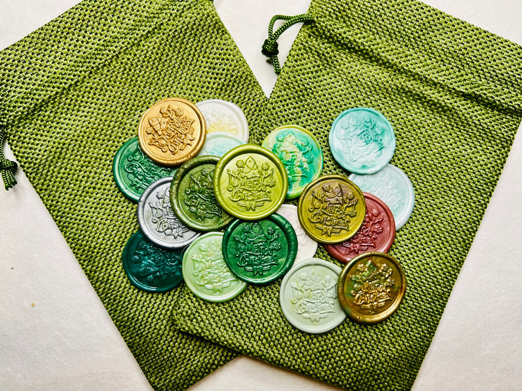Festive wax seal stickers embossed with “Merry Christmas” with a charming tree and presents