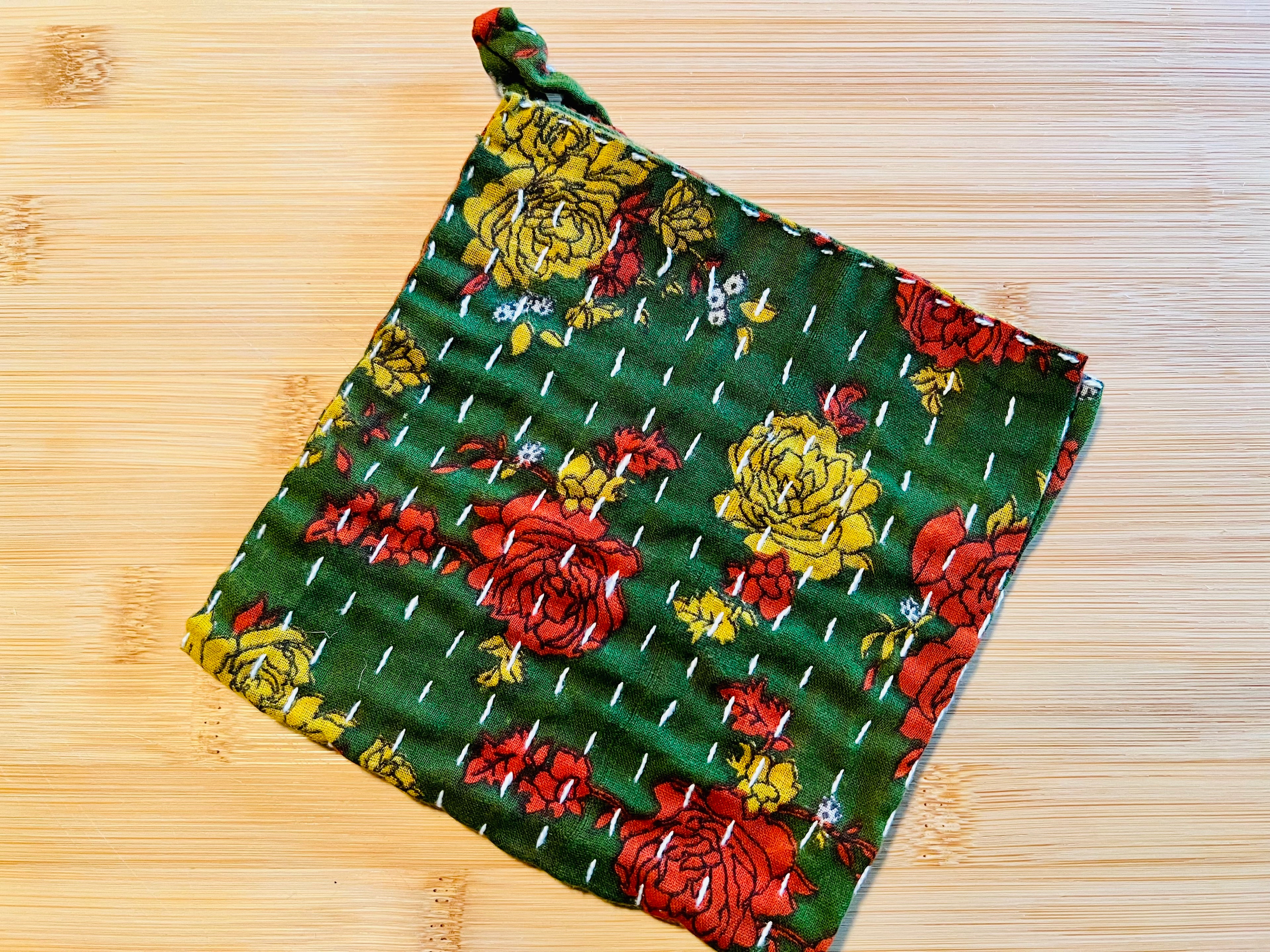 Floral patterned towel on a wooden surface