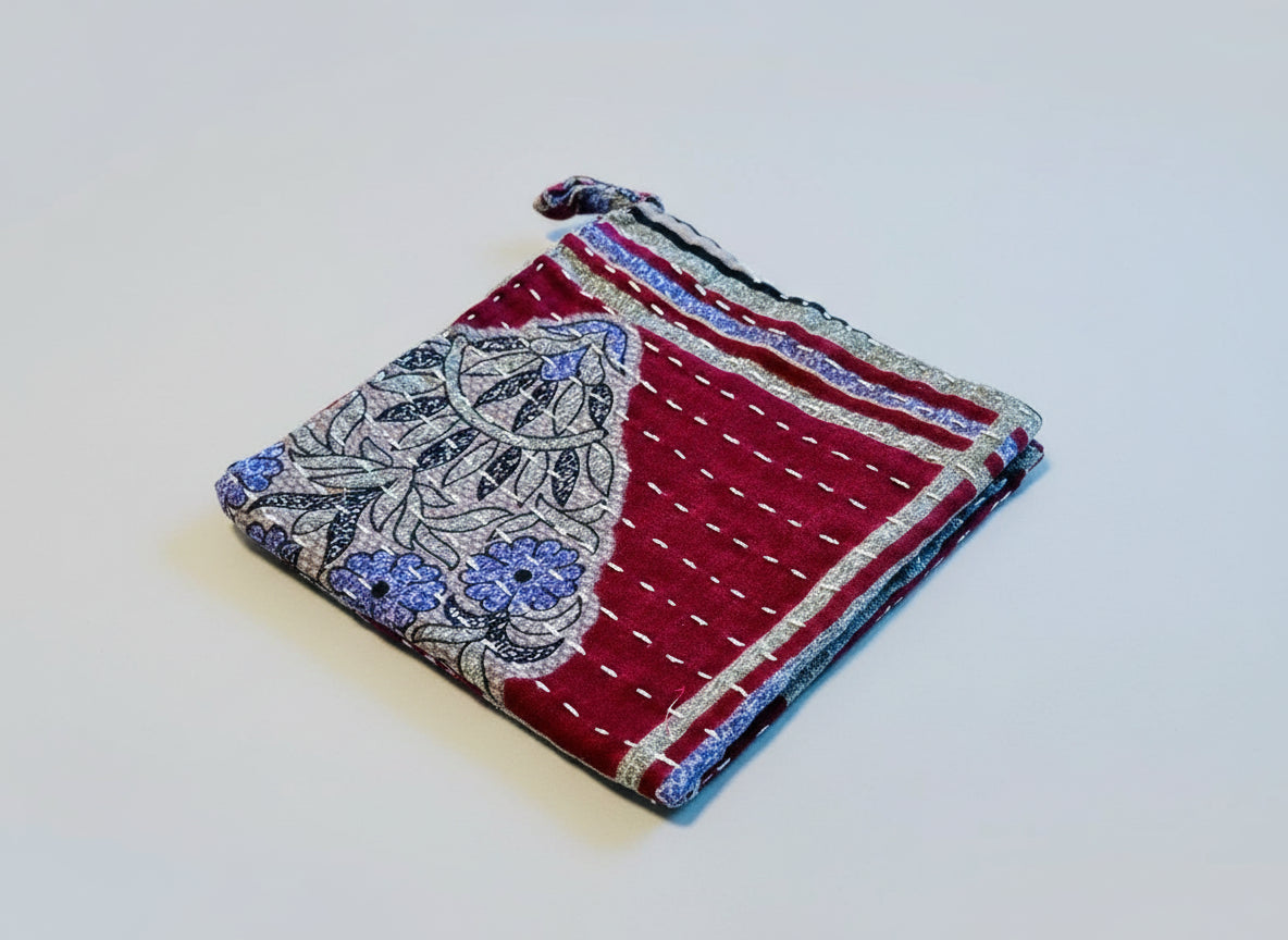 Decorative Kantha dish cloth with a beautiful floral motif in various colors.